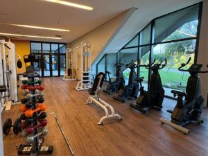 a gym with treadmills and exercise bikes in a room at ibis Styles Taubate in Taubaté
