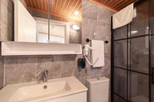 a bathroom with a sink and a toilet and a mirror at Satsuma Butik Otel in Seferihisar +51 photos
