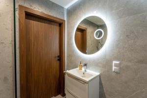 a bathroom with a sink and a mirror at Bieszczady Hill - Dolna in Czarna