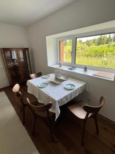 a dining room with a table and chairs and a window at Refugium Mitterbach in Mitterbach +39 photos