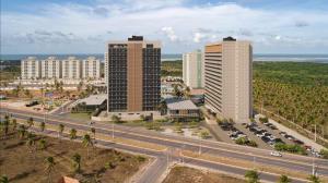 two tall buildings in a city with a highway at Beach GAV Resort in Salinópolis