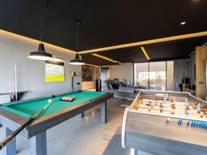 a living room with a pool table in it at Luxury Premium Villa Golf Resort Private Pool in Marrakesh