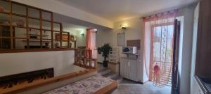 a room with a door to a kitchen with a window at Deby House in Oggebbio