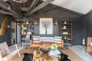 a living room with a couch and a table at Breathtaking Boutique Treehouse nestled in clouds in Beech Mountain