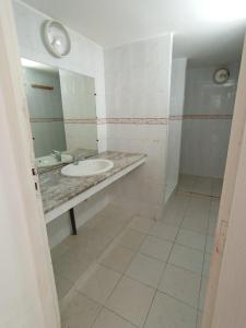 a bathroom with a sink and a mirror at Maison de plage familiale à Cabo in Cabo Negro +23 photos
