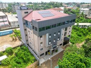 an overhead view of a building with solar panels on its roof at Angel's hôtel in Douala