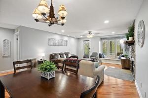 a dining room and living room with a dining table at Hiking Trails King Bed View Recently Renovated in Sugar Mountain