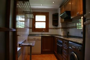 A kitchen or kitchenette at Apartamentos Cogulla