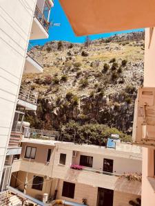 a view of a mountain from a building at Shengjin Central Apartments in Shëngjin