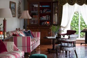 a living room with a couch and a table at Earls Court House in Killarney
