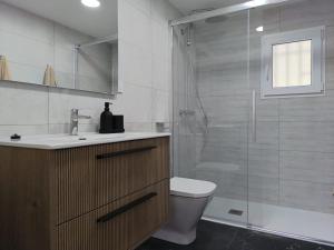 a bathroom with a shower and a toilet and a sink at Sweet November in Valencia +45 photos