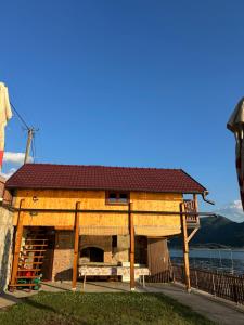 a building on the side of a body of water at Lure House in Mali Zvornik +14 photos
