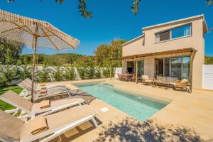 a villa with a swimming pool and a house at Villa Romas 3 by Villa Plus in Vasilikos