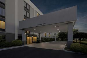 a building with a sign that reads cancer institute at Allentown Park Hotel by The Red Collection in Fogelsville
