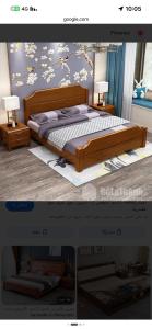 a bedroom with a wooden bed with flowers on the wall at شقق ورد in Al Barkah