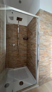 a shower with a glass enclosure in a bathroom at La Vigna 1803 in Casa Gagliano +12 photos
