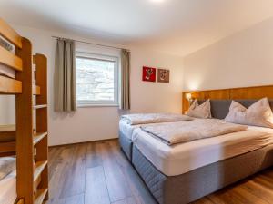 a bedroom with a bed and a bunk bed at Bergblick in Werfenweng