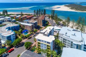 an aerial view of a city with a beach at Caloundra Affordable Beachside Studio in Caloundra