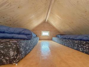 a room with two beds in a attic at Yellow Bird in Ellemeet +22 photos