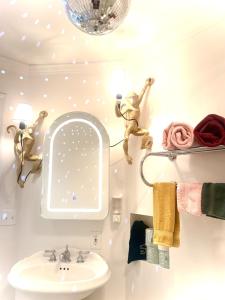 a bathroom with a sink and a mirror at Catskill Apartment, Little Love Bird #5 in Shandaken +32 photos