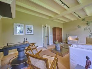 a living room with a pool table and a couch at De Muldershof in Vriezenveen