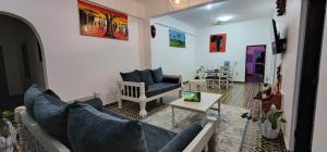 a living room with a couch and a table at Charlie's Place Watamu in Watamu