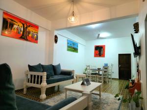 a living room with a couch and a table at Charlie's Place Watamu in Watamu