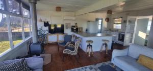 a kitchen and living room in a tiny house at The waterfront retreat in Lock Sport