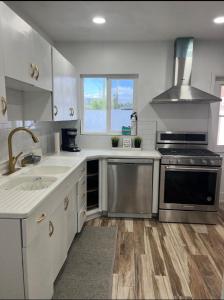 a kitchen with a sink and a stove top oven at West Mitchell in Phoenix
