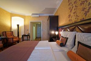 Postel nebo postele na pokoji v ubytování SKARITZ Hotel & Residence