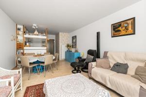 a living room with a couch and a table at Lombardie 0502 in Nieuwpoort
