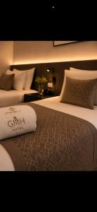 a hotel room with two beds and a pillow at tyty cairo hotel in Cairo