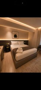 a bedroom with a large bed in a room at tyty cairo hotel in Cairo