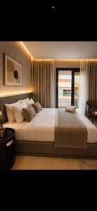 a bedroom with a large bed with a window at tyty cairo hotel in Cairo
