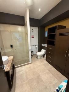 a bathroom with a toilet and a sink and a shower at departamento 314 in Nuevo Nayarit