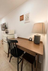 a desk with a lamp and a chair in a room at 303 Stayonyou Gocheok Dome Hongdae Subway 3Min in Gwangmyeong +17 photos