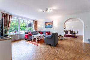 a living room with a couch and a table at Villa-Magnolia-H in Hohwacht