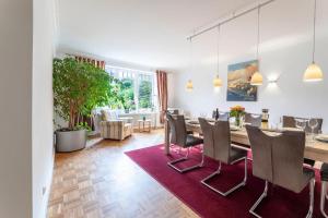 a dining room with a table and chairs at Villa-Magnolia-H in Hohwacht