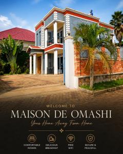 a welcome to mission de oasis sign in front of a house at Maison De Omashi in Kigali