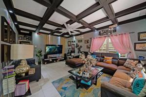 a living room with a couch and a table at Hidden Gem Barbados in Christ Church