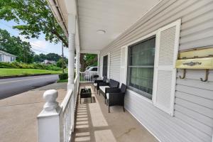 a porch with chairs and a window on a house at Charming 2-Bedroom, 1-Bath Getaway in Carbondale