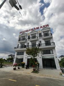 a white building with a sign on top of it at Hotel Trâm Anh 3 in Nhơn Trạch