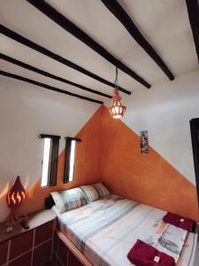 a bedroom with a bed in a room at Cabañas Cañon Del Chicamocha in Aratoca
