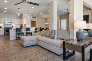 a living room and kitchen with a couch and a table at Hilton Vacation Club Daytona Seabreeze Daytona Beach in Daytona Beach