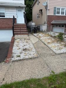 a driveway with snow on the ground in front of a house at 50 Private Lounge in Irvington