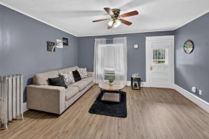 a living room with a couch and a ceiling fan at 1-Bedroom, 1-Bath Getaway in Carbondale