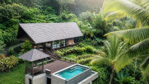 an aerial view of a house with a swimming pool at Villa Togog Jatiluwih - Adults Only in Jatiluwih