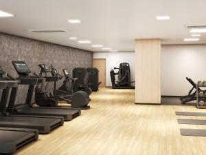 a gym with treadmills and elliptical machines at ANA Crowne Plaza Kochi by IHG in Sagamichō +57 photos