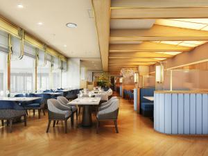 a dining room with tables and chairs at ANA Crowne Plaza Kochi by IHG in Sagamichō