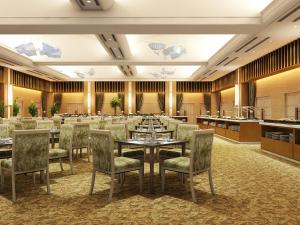 a large banquet hall with tables and chairs at ANA Crowne Plaza Kochi by IHG in Sagamichō